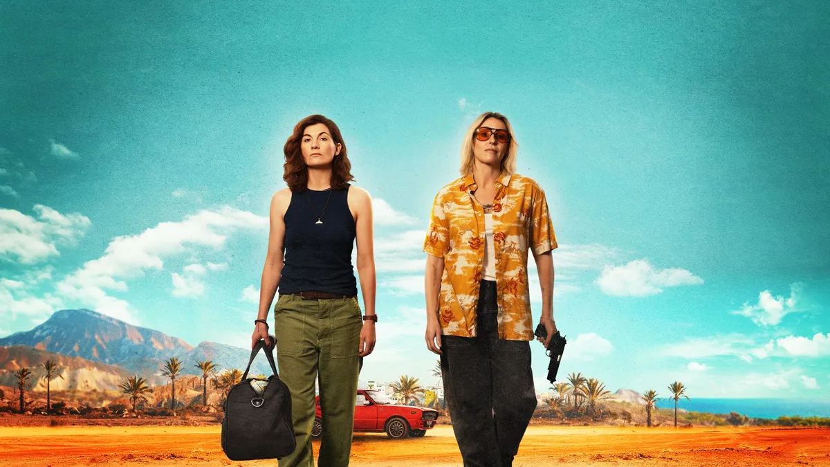 Suranne Jones and Jodie Whittaker in Frauds key art, pictured side by side walking towards the camera, away from a red car in the background