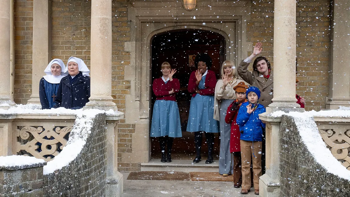 Call The Midwife cast standing on a snow covered doorstep